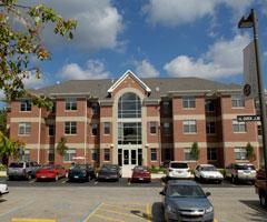 Parking lot in front of one of the Aquinas apartment buildings